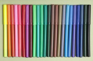 Colored pencils and markers for drawing. photo