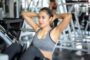 young asian woman workout and exercise at fitness gym. photo