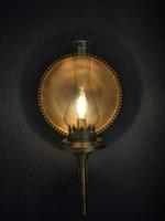background photo of yellow lantern lamp covered in shadow
