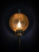 background photo of yellow lantern lamp covered in shadow