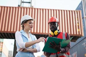 foreman checking containers in the terminal, at import and export business logistic company. photo