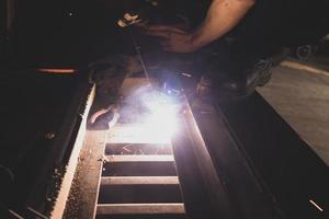 welder, welding automotive part in a car factory photo