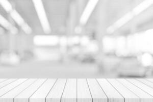 Empty white table top, counter over blur white bokeh light background. wooden shelf for product display, banner or mockup. photo