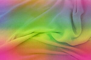 tela suave en los colores del arcoíris. fondo de textura de tela multicolor foto