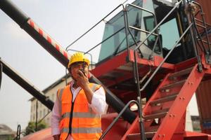 industry worker control loading containers in the container terminal photo