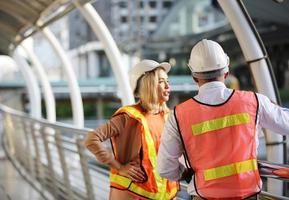Architect of construction engineer working in construction site and management in the construction site photo