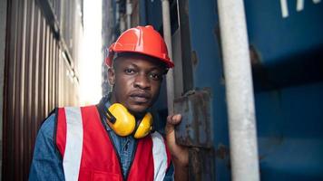 foreman checking containers in the terminal, at import and export business logistic company. photo