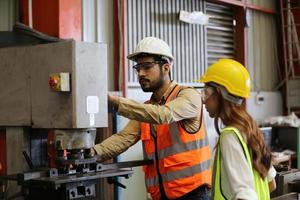 Industry worker Foreman or worker work at factory site check up machine or products in site. Engineer or Technician checking Material or Machine on Plant. Industrial and Factory. photo