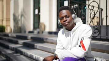 Portrait of young African American hipster man posing at outdoor. photo