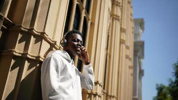 Portrait of young African American hipster man posing at outdoor. photo