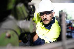 Professional men engineer worker skills quality, maintenance, training industry factory worker , warehouse Workshop for factory operators, mechanical engineering team production. photo