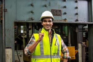 Foreman or worker work at factory site check up machine or products in site. Engineer or Technician checking Material or Machine on Plant. Industrial and Factory. photo