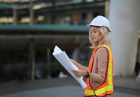 Architect of construction engineer working in construction site and management in the construction site photo