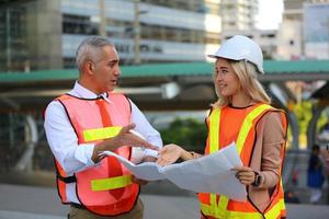 Architect of construction engineer working in construction site and management in the construction site photo