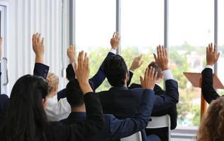 Speaker giving presentation in hall. Audience or conference hall. Rear view of unrecognized participants in audience. Scientific conference event, training photo