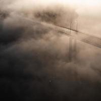 Aerial view of bridge in fog