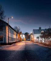 Empty street and street lights at night photo