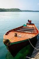 Thai traditional wooden longtail boat at pier. Koh Kood island, Thailand. photo