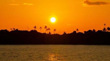 Sunset at summery tropical island. Silouette Koh Kood island, Thailand. photo