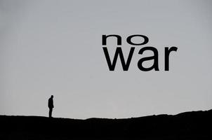 no war single man black on a hill in black letters photo