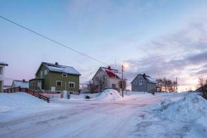 Tree wooden house in snowy winter photo