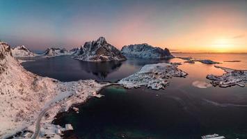 Sunrise on Lofoten island is archipelago with fishing village on coastline in winter at Norway photo