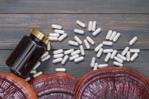 Ganoderma lucidum mushroom and capsule with bottle mockup photo