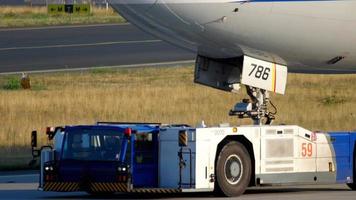 Airplane towing to service, close-up video