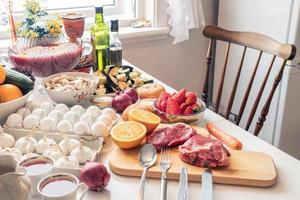 Ingredient raw food with vegetables and fruits preparing for cooking on the table photo