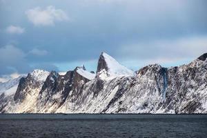 Segla snowy mountain peak in ocean photo