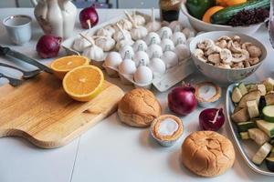 Food ingredients with fruits, vegetables,bread and kitchenware photo