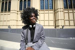 Portrait of young African American hipster man posing at outdoor. photo