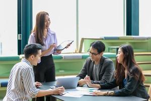 business people brainstorming and discussing business plan on meeting photo