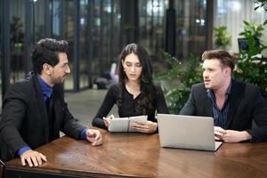 Group of business people collaborating in office or Multiethnic business people in meeting. photo