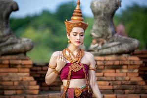 Asia woman wearing traditional Thai dress,The costume of the national dress of ancient Thailand. photo