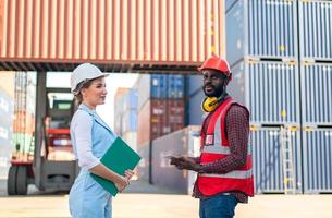 Foreman checking containers in the terminal, at import and export business logistic company. photo