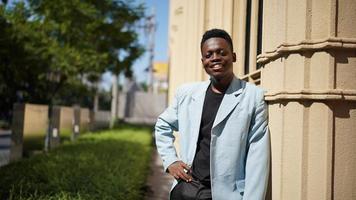 Afro American man having fun walking in city center - Happy young guy enjoying time a sunset outdoor - Millennial generation lifestyle and positive people attitude concept photo