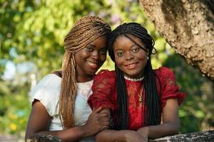 Best friends embracing, couple Afro girl smailing. photo