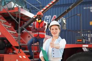 foreman checking containers in the terminal, at import and export business logistic company. photo