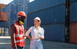 foreman checking containers in the terminal, at import and export business logistic company. photo