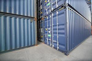 Foreman control loading Containers box from Cargo freight ship for import export. photo