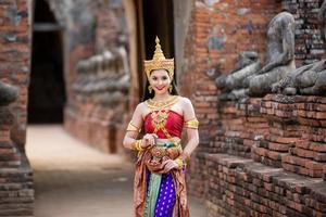 Asia woman wearing traditional Thai dress, The costume of the national dress of ancient Thailand. photo