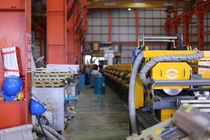 heavy industrial factory. The Maintenance looking of working at industrial machinery and check security system setup in factory. photo