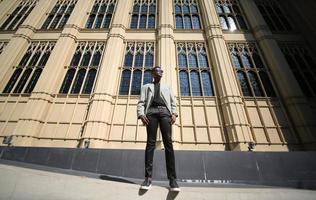 Portrait of young African American hipster man posing at outdoor. photo