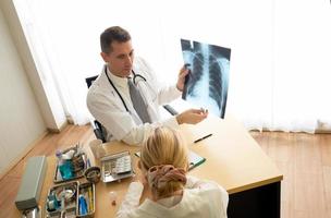 Doctor and patient in hospital photo