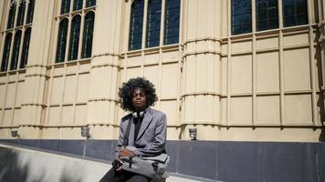 Portrait of young African American hipster man posing at outdoor. photo