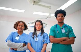 International doctor team. Hospital medical staff. Mixed race Asian and Caucasian doctor and nurse meeting. Clinic and stethoscope. photo