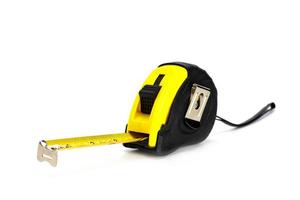 yellow  tape measure  isolated on white background photo