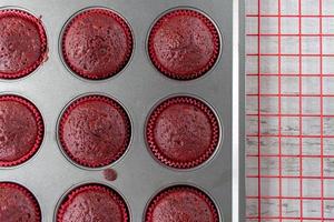 baked red velvet cupcakes on red wire rack photo