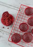 baked red velvet cupcakes on red wire rack photo